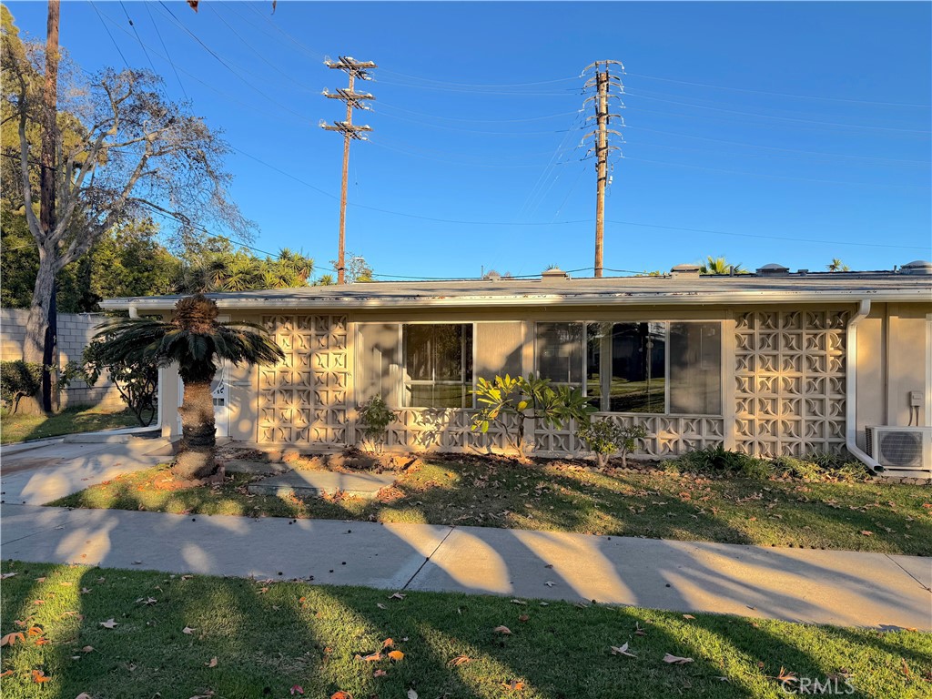 1240 Scioto Road, Unit 228F Seal Beach, CA 90740 - Photo 36 of 38 a front view of a house with a yard