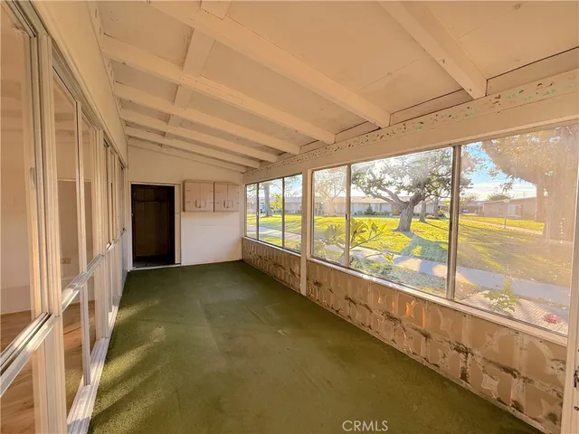 a view of an empty room with a large window