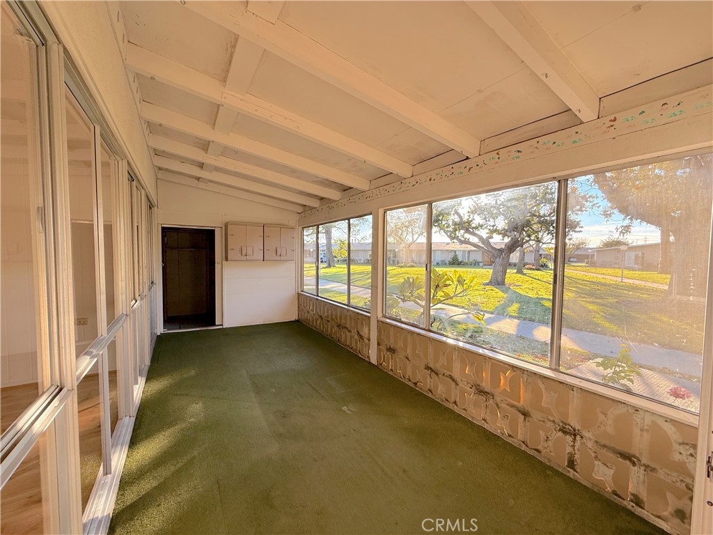 1240 Scioto Road, Unit 228F Seal Beach, CA 90740 - Photo 6 of 38 a view of an empty room with a large window