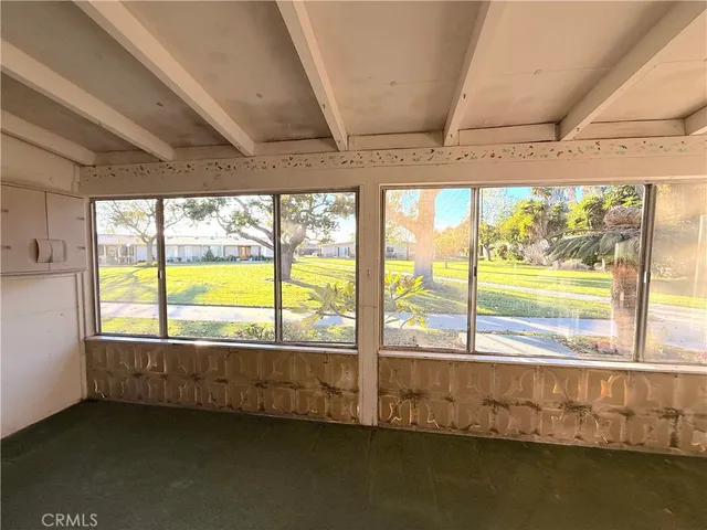 a view of an empty room with a large window