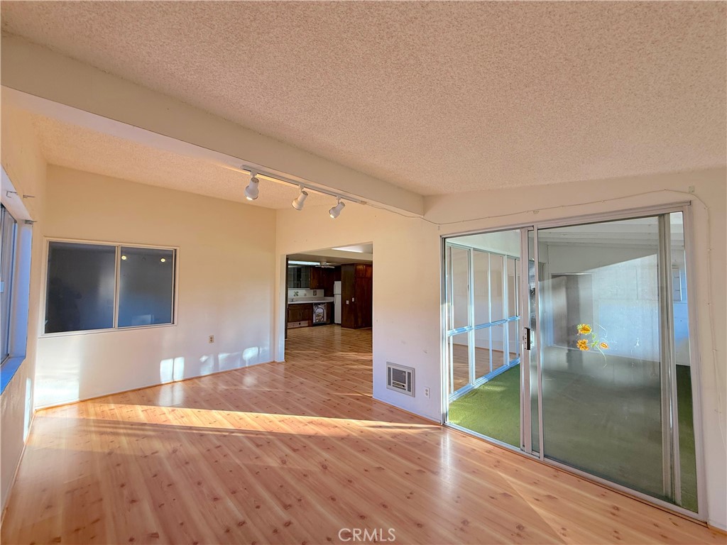 1240 Scioto Road, Unit 228F Seal Beach, CA 90740 - Photo 9 of 38 a view of a hallway with wooden floor