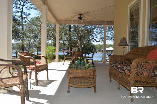 8919 Red Fish Pt Road Lillian, AL 36549 - Photo 5 of 46 Expansive wrap around, covered porch.