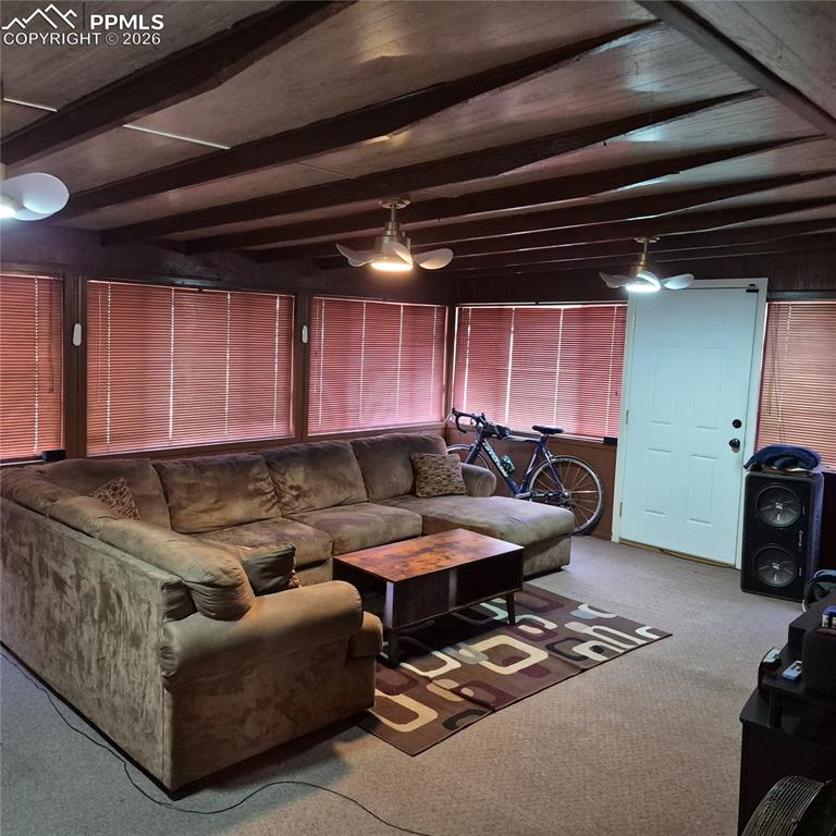 35 Mac Arthur Road Pueblo, CO 81001 - Photo 11 of 13 a living room with furniture and a car