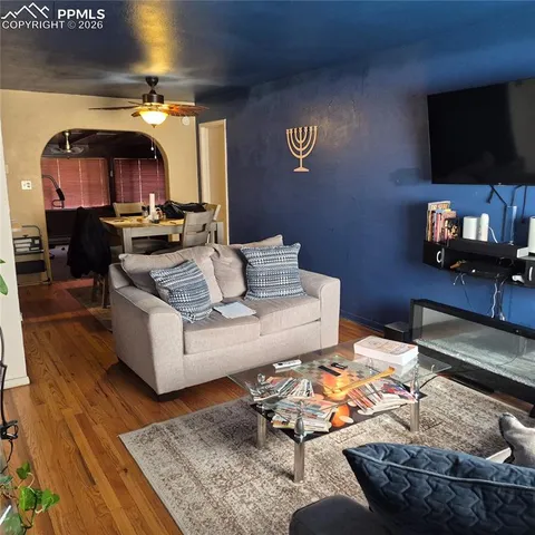 a living room with furniture and a flat screen tv