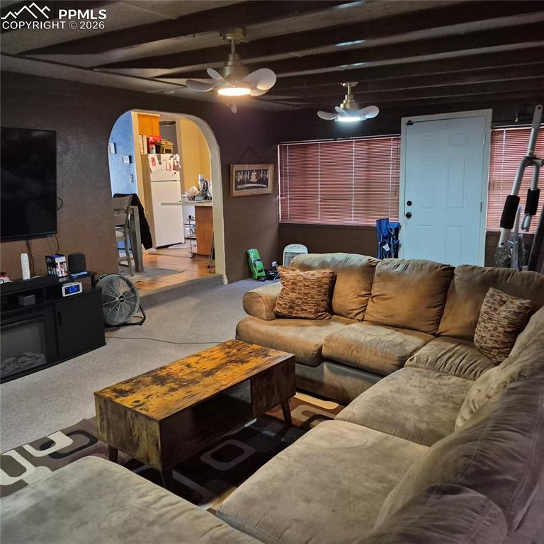 35 Mac Arthur Road Pueblo, CO 81001 - Photo 10 of 13 a living room with furniture and a mirror