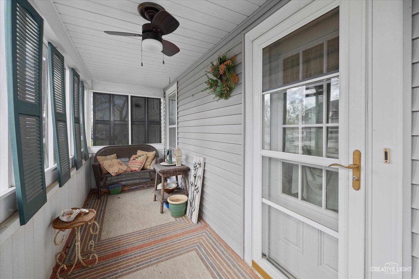 41-w684 Russell Road Elgin, IL 60124 - Photo 3 of 17 a balcony view with a couch and wooden floor