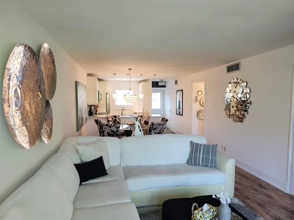 a view of a living room and dining room