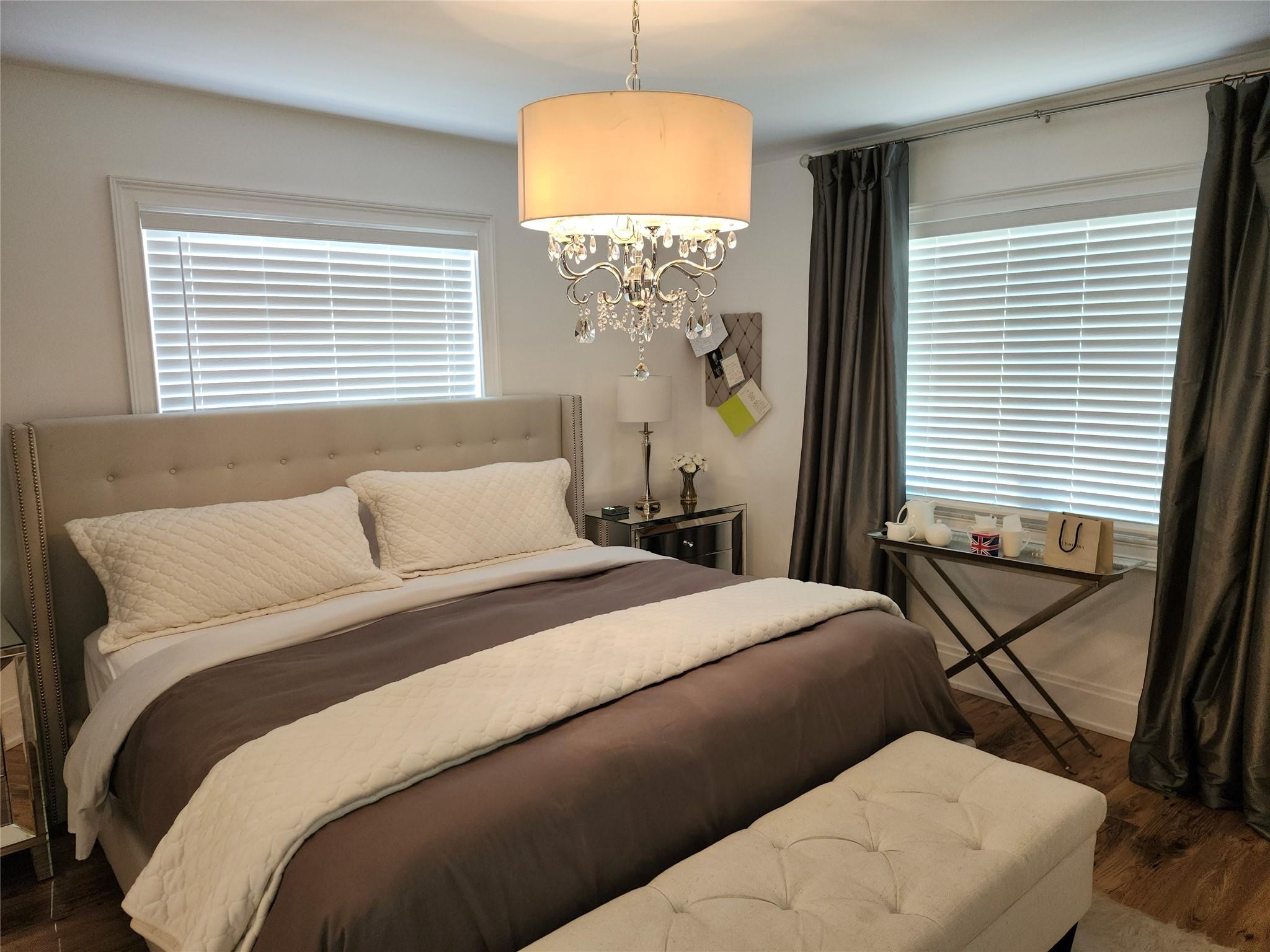 301 Cambridge Road, Unit 301 Hollywood, FL 33024 - Photo 14 of 31 a bedroom with a bed and a window