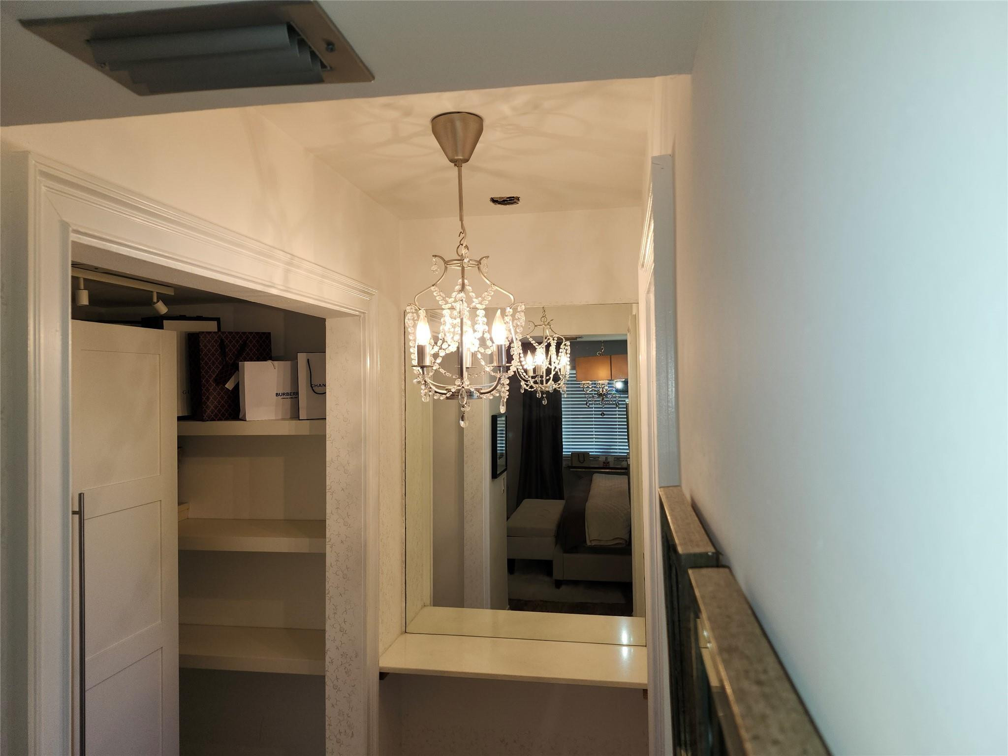 301 Cambridge Road, Unit 301 Hollywood, FL 33024 - Photo 16 of 31 a view of a hallway and a livingroom with furniture