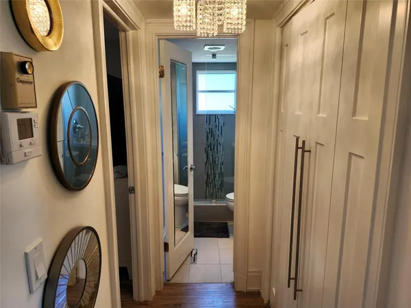 a bathroom with a mirror a bathtub and a shower