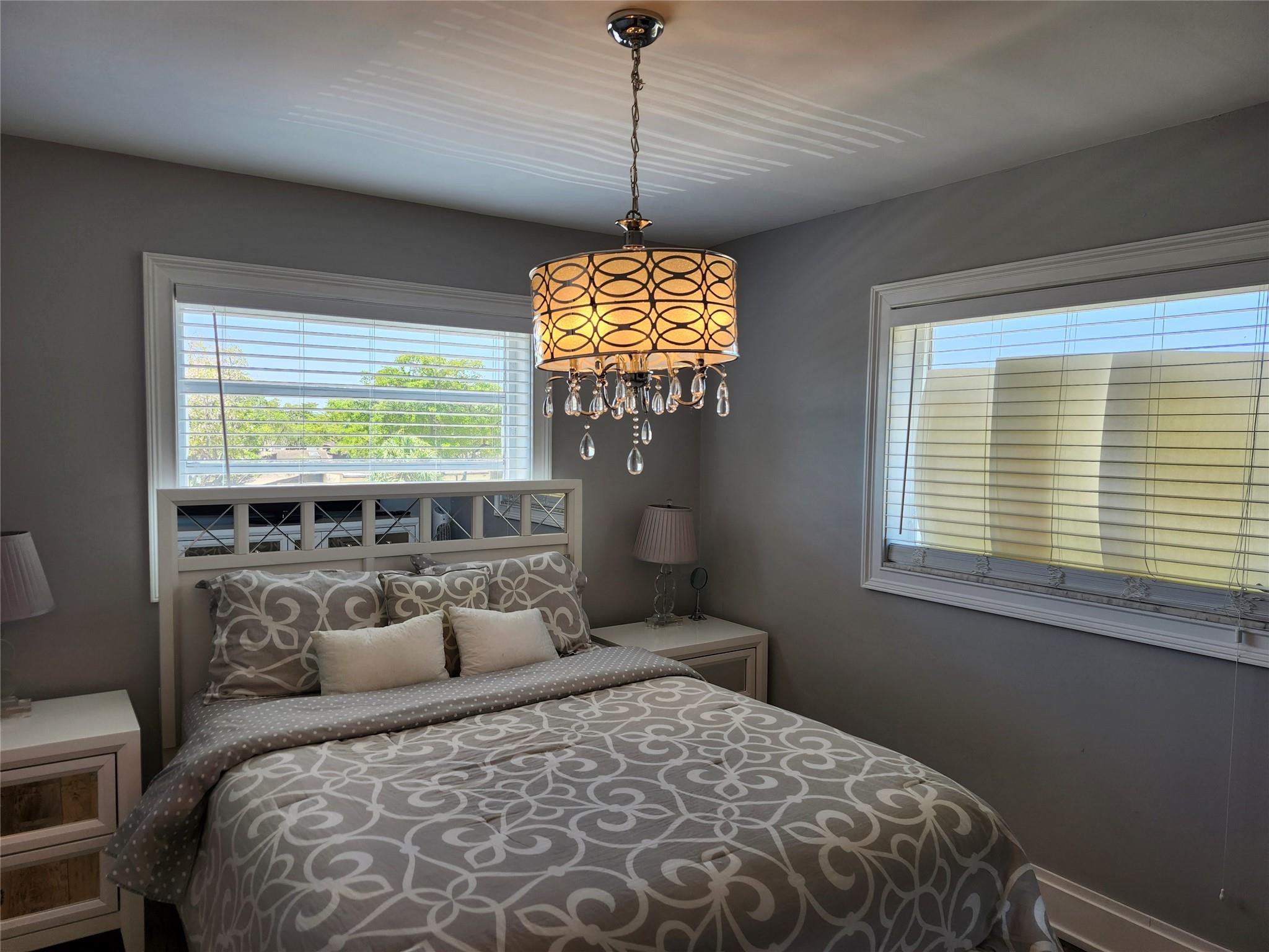 301 Cambridge Road, Unit 301 Hollywood, FL 33024 - Photo 21 of 31 a bedroom with a bed and a window