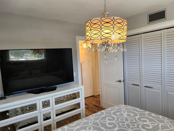 a view of a livingroom with wooden floor and closet
