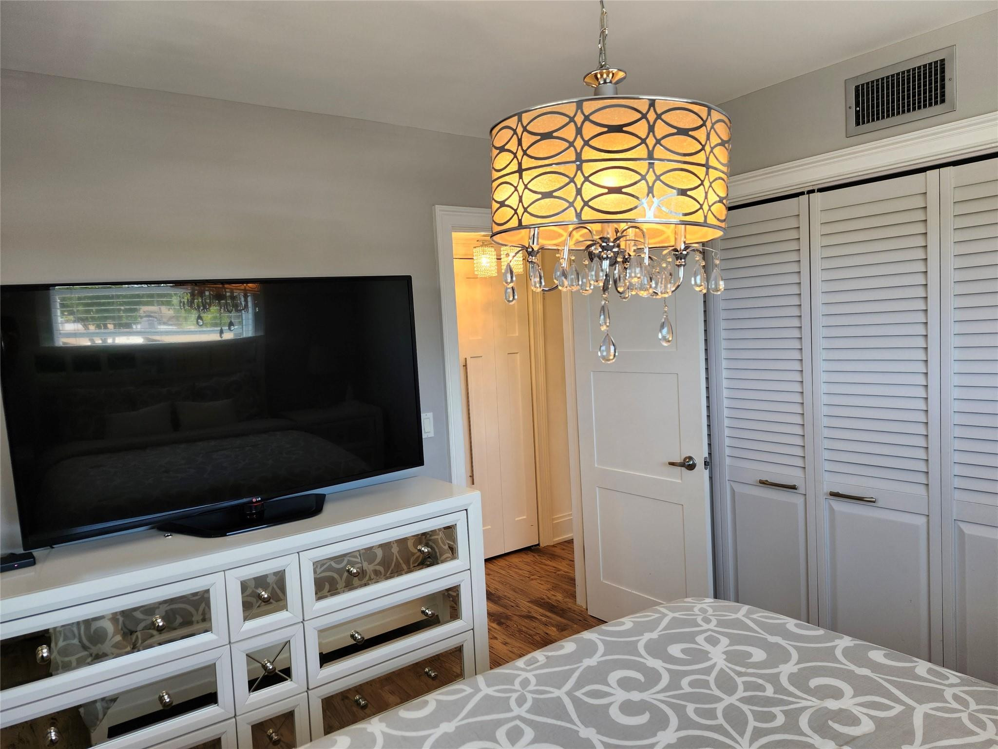 301 Cambridge Road, Unit 301 Hollywood, FL 33024 - Photo 22 of 31 a view of a livingroom with wooden floor and closet