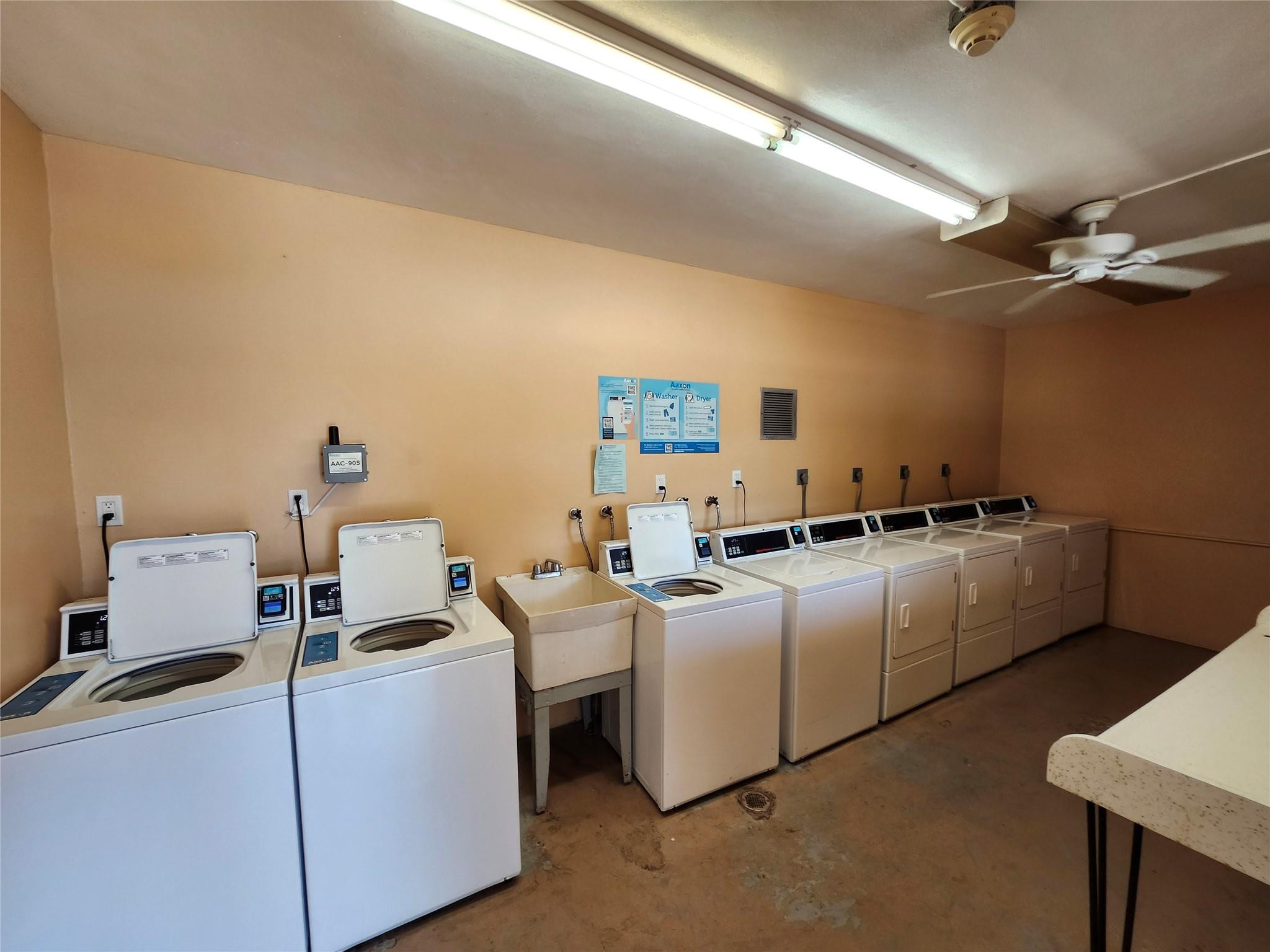 301 Cambridge Road, Unit 301 Hollywood, FL 33024 - Photo 25 of 31 a room with furniture and a flat screen tv