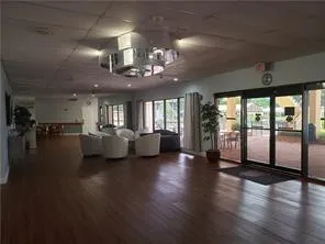a lobby with furniture and floor to ceiling windows
