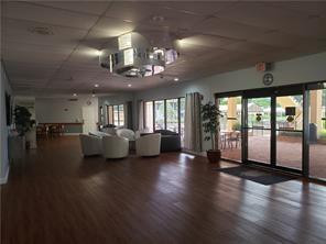 301 Cambridge Road, Unit 301 Hollywood, FL 33024 - Photo 27 of 31 a lobby with furniture and floor to ceiling windows