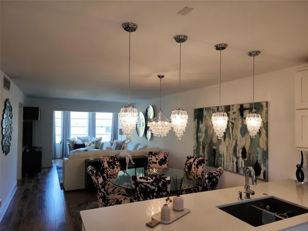 a room with lots of chandelier and couch