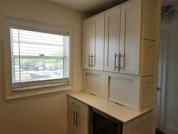 a view of cabinets and window