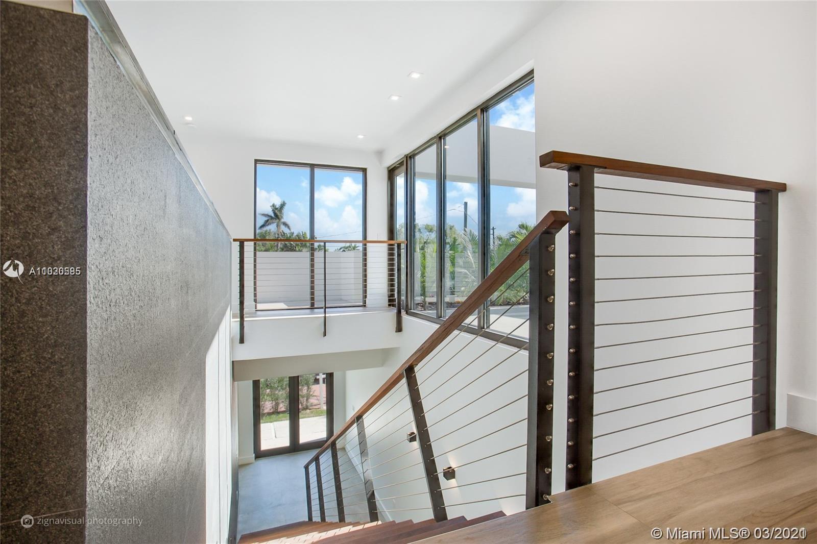 4530 Alton Road Miami Beach, FL 33140 - Photo 12 of 25 a view of an entryway with staircase