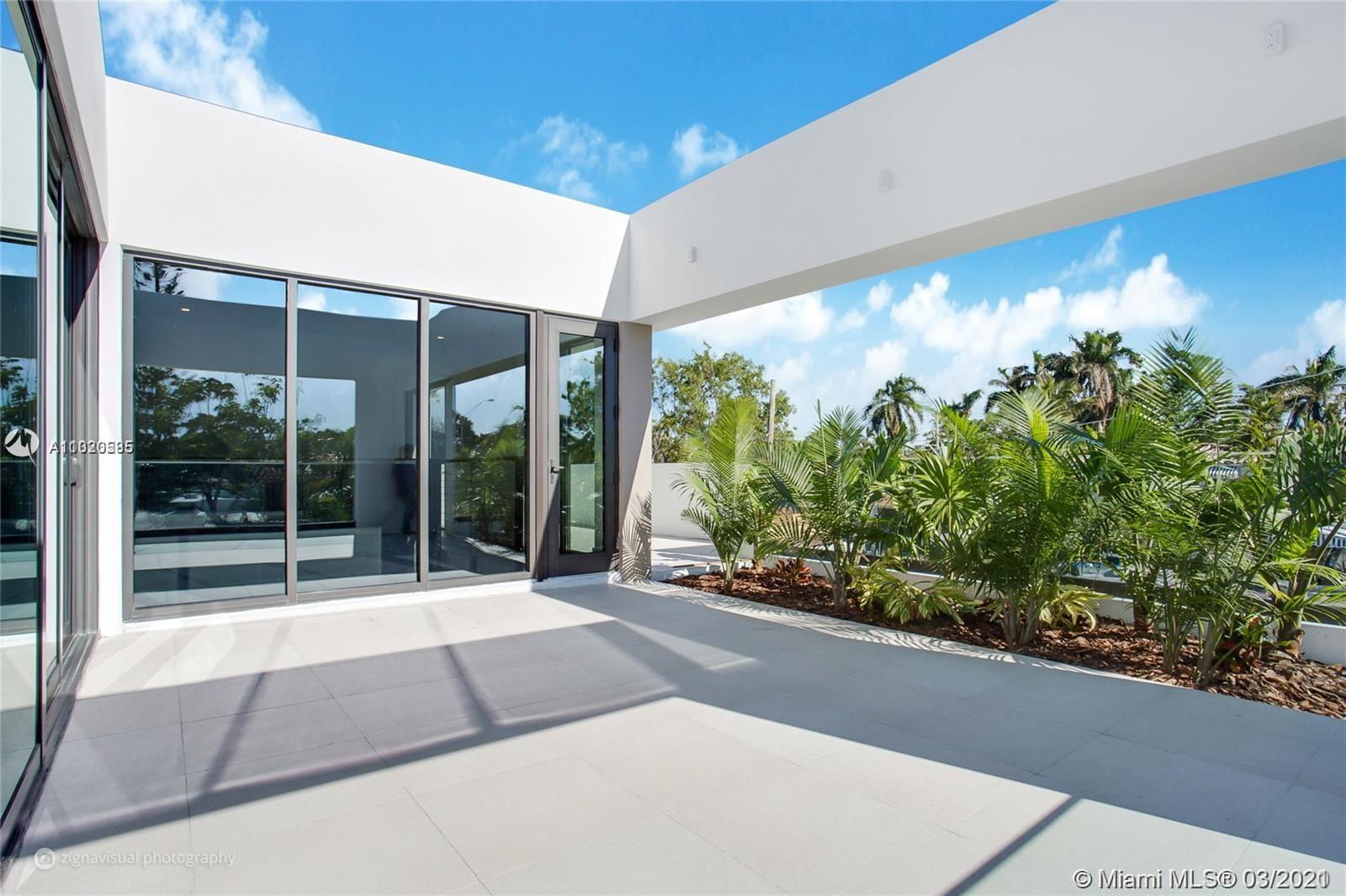 4530 Alton Road Miami Beach, FL 33140 - Photo 14 of 25 a house view with a garden space