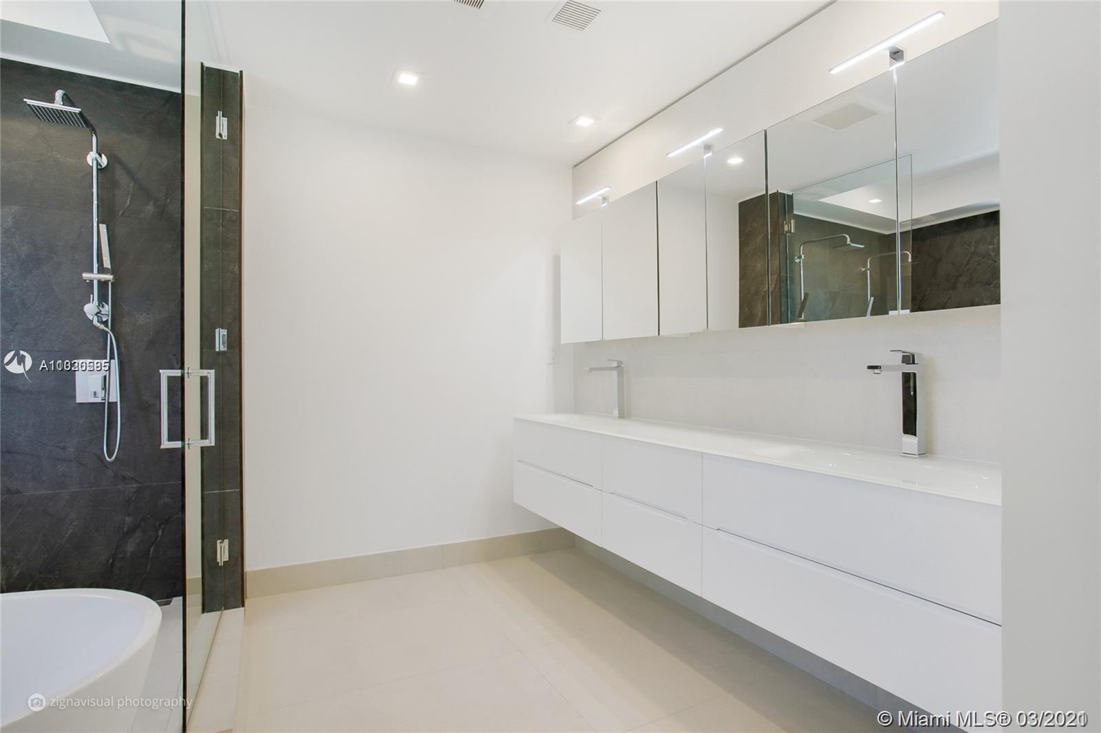 4530 Alton Road Miami Beach, FL 33140 - Photo 20 of 25 a bathroom with a bathtub and a shower