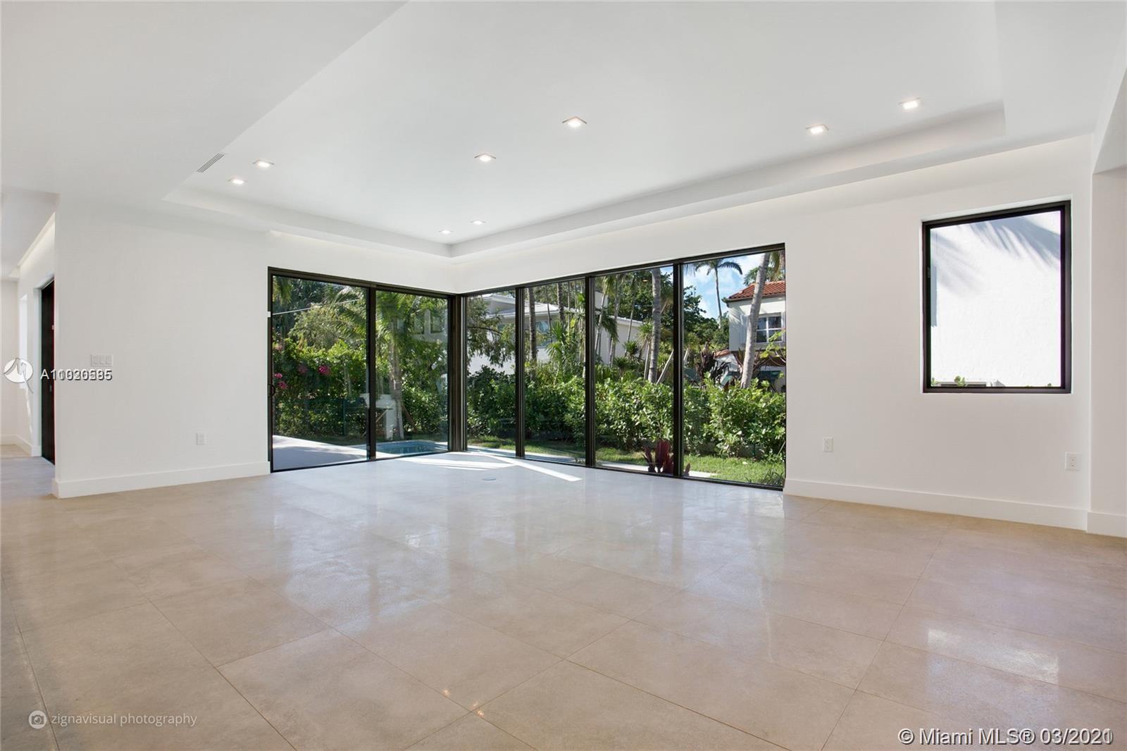 4530 Alton Road Miami Beach, FL 33140 - Photo 6 of 25 a view of an empty room with a window