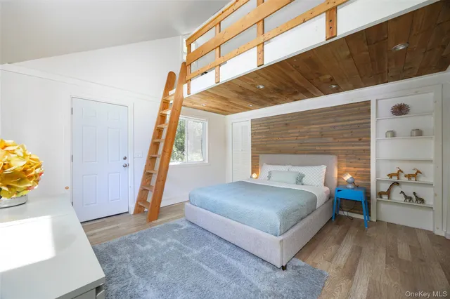 a spacious bedroom with a bed and a table