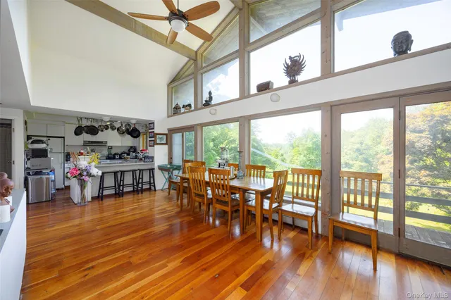 a living room with lots of furniture and wooden floor