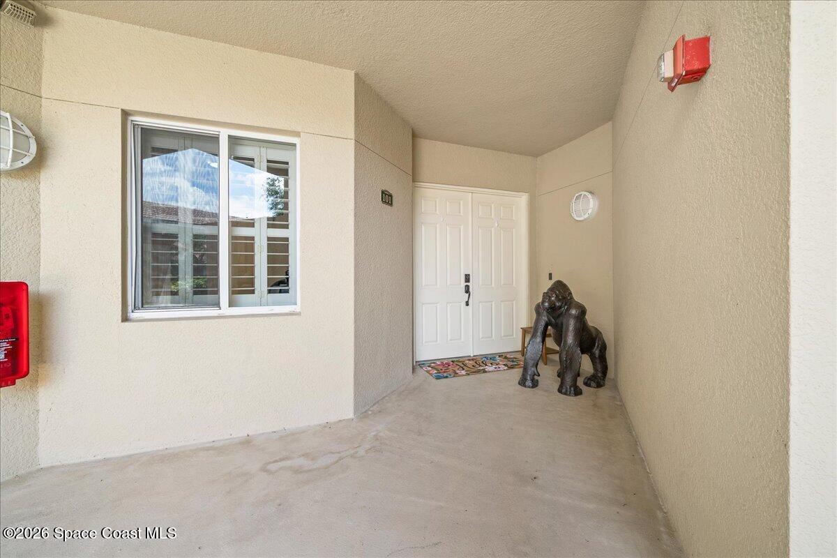6005 Highway 1, Unit 101 Rockledge, FL 32955 - Photo 6 of 57 a view of a livingroom with a car park side of a road