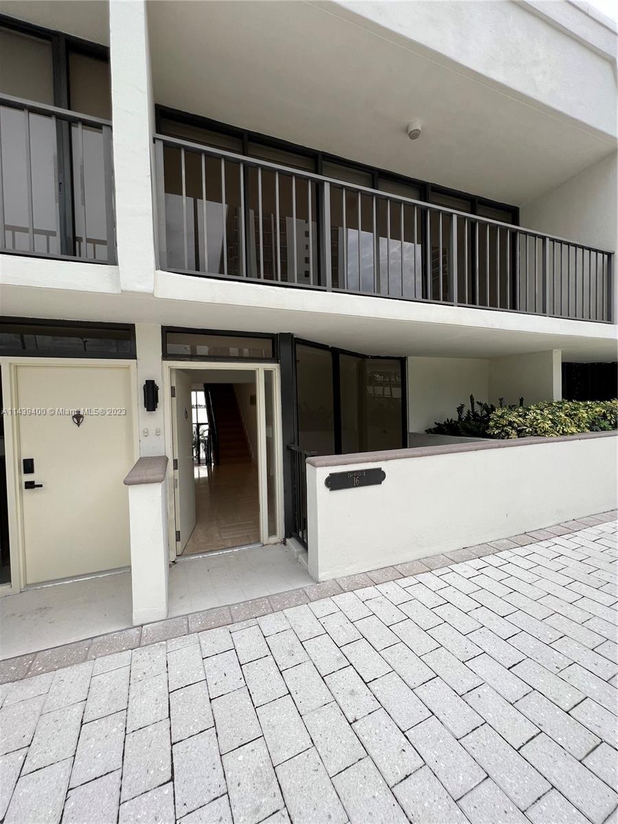 1915 Brickell Avenue, Unit TH16 Miami, FL 33129 - Photo 14 of 36 a front view of a house with entryway
