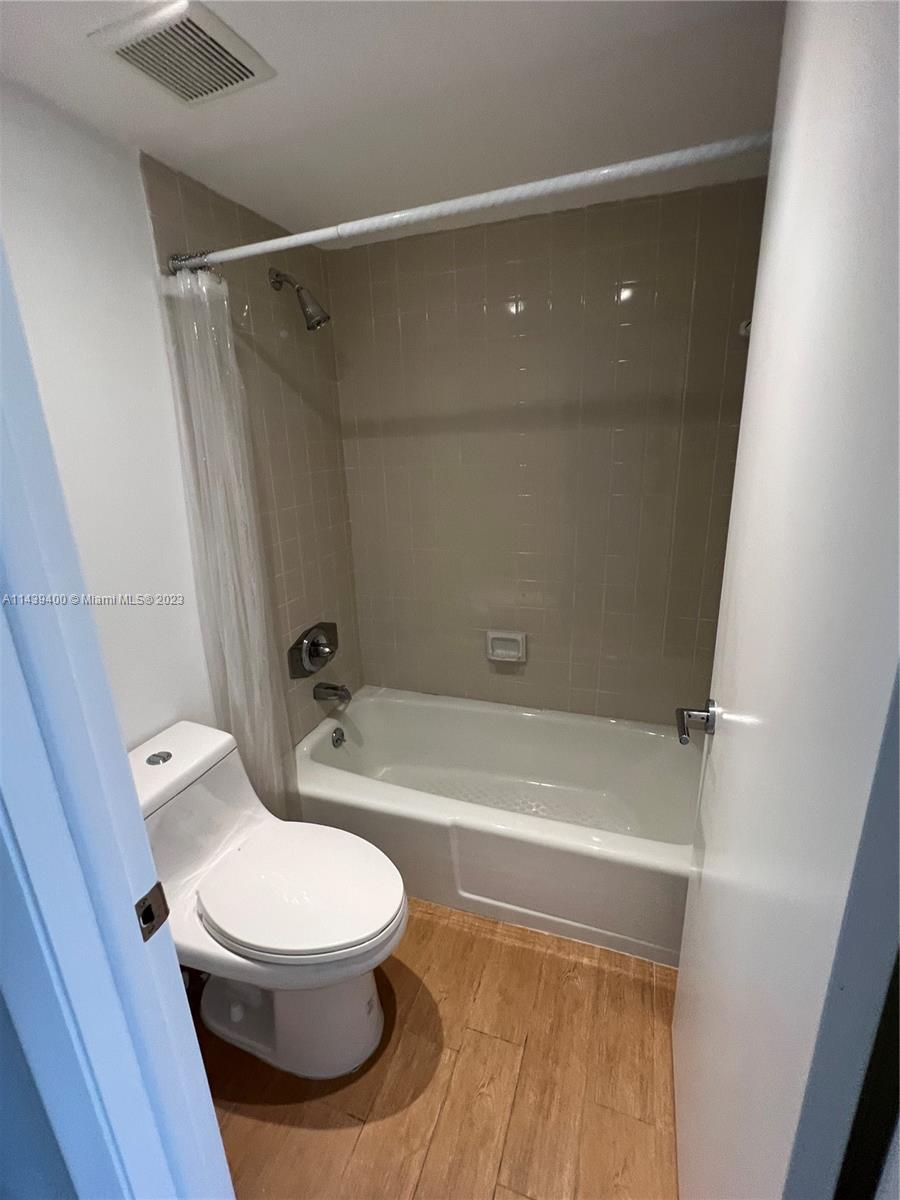 1915 Brickell Avenue, Unit TH16 Miami, FL 33129 - Photo 28 of 36 a bathroom with a toilet and a shower