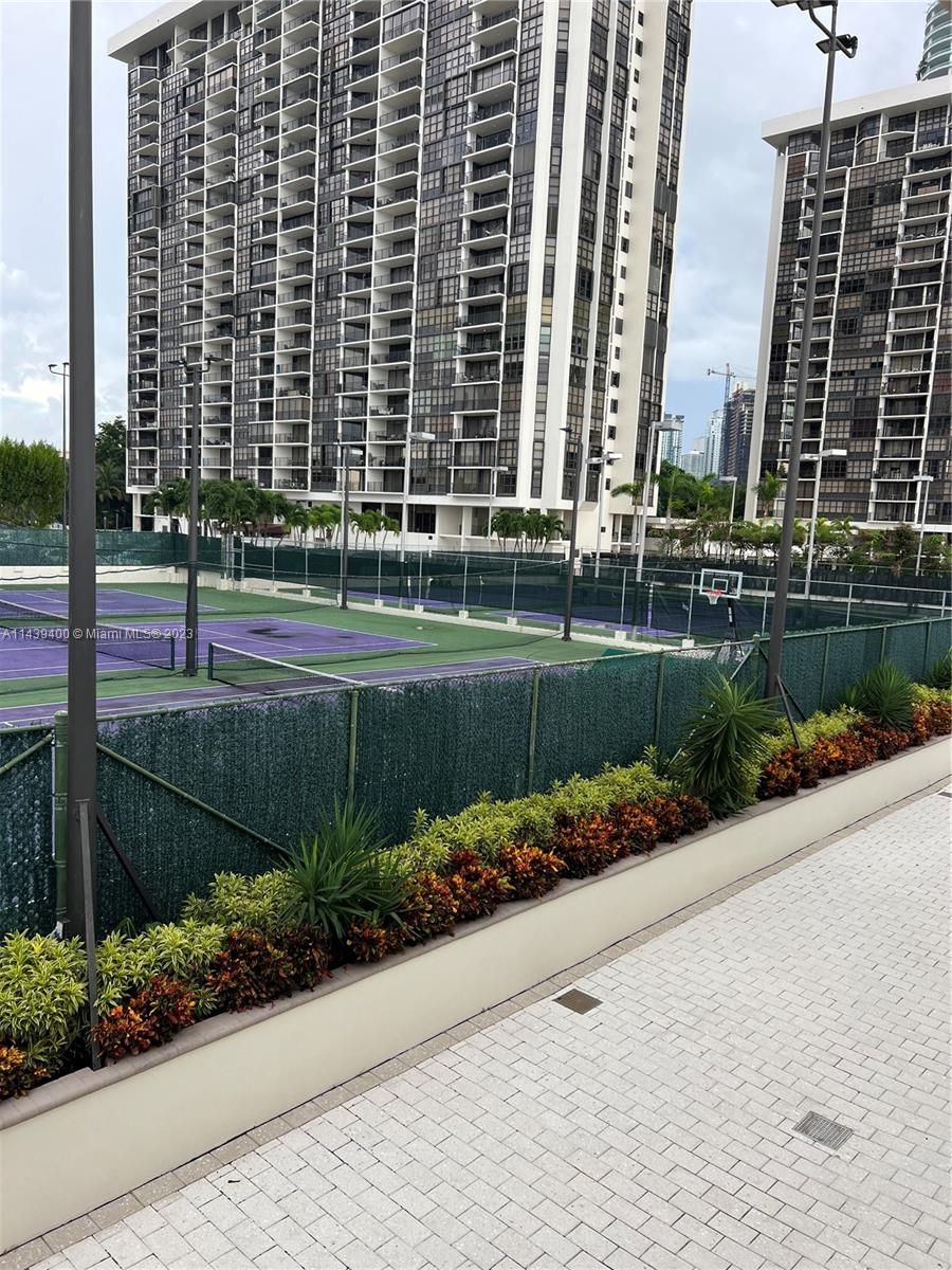 1915 Brickell Avenue, Unit TH16 Miami, FL 33129 - Photo 32 of 36 a view of a garden with a bench in the patio