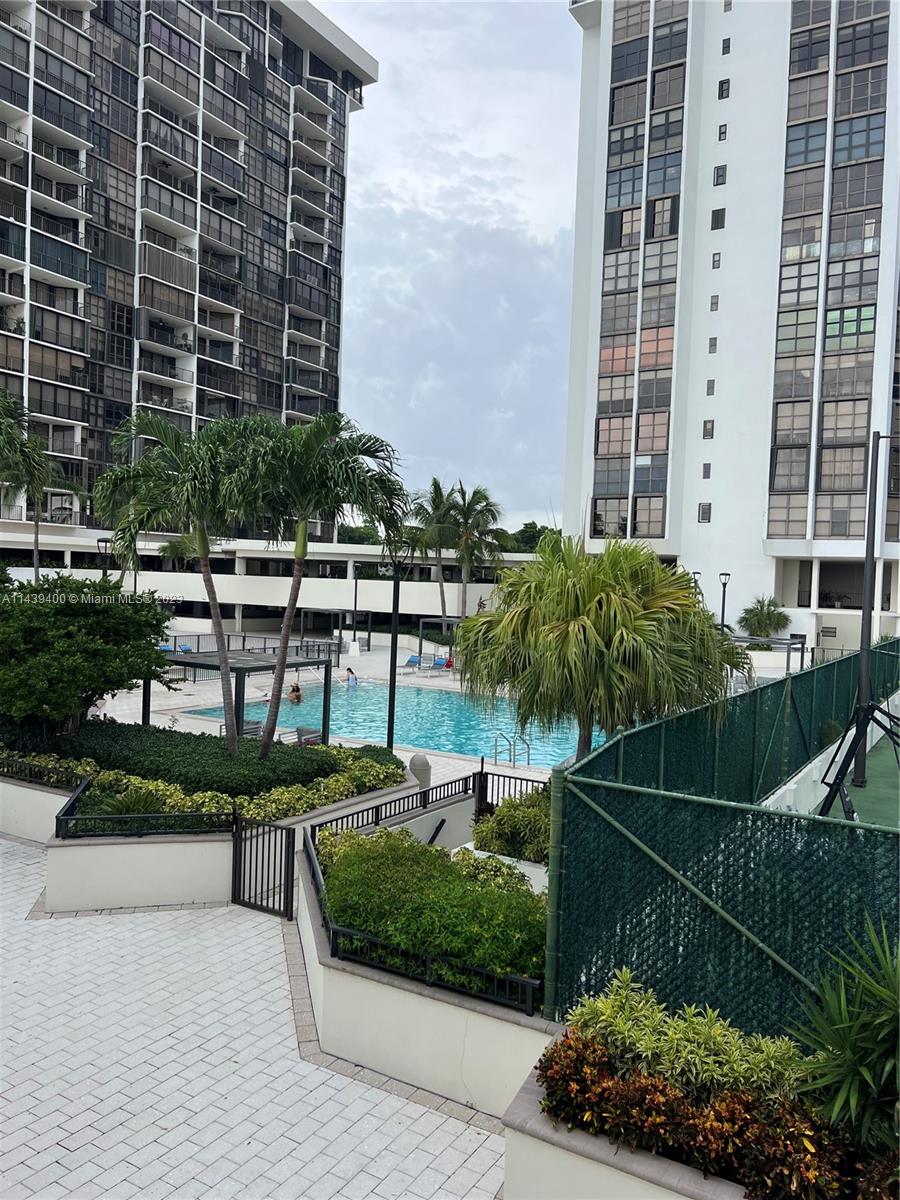 1915 Brickell Avenue, Unit TH16 Miami, FL 33129 - Photo 34 of 36 a view of a backyard with couches and potted plants