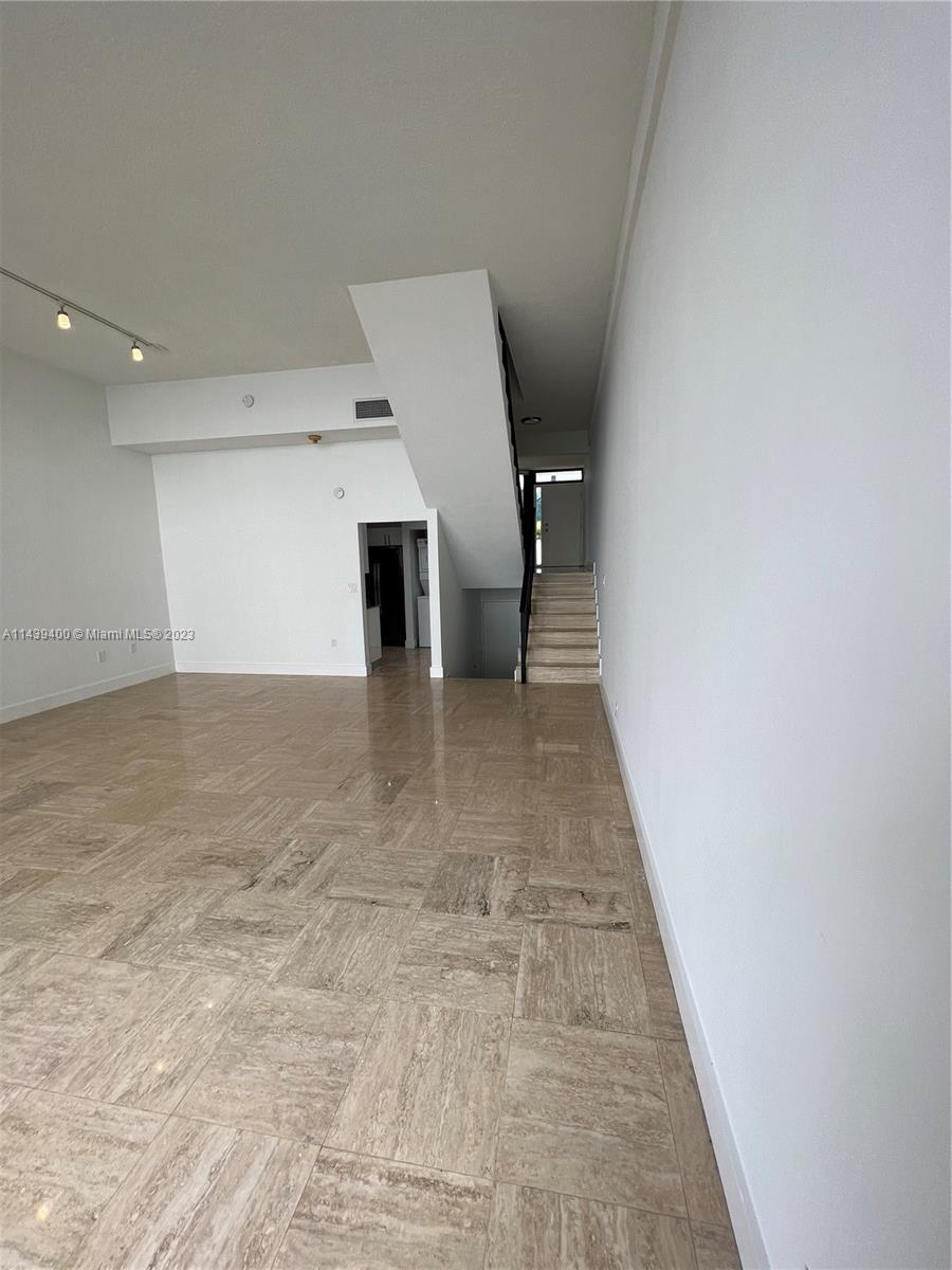 1915 Brickell Avenue, Unit TH16 Miami, FL 33129 - Photo 5 of 36 a view of a hallway with stairs