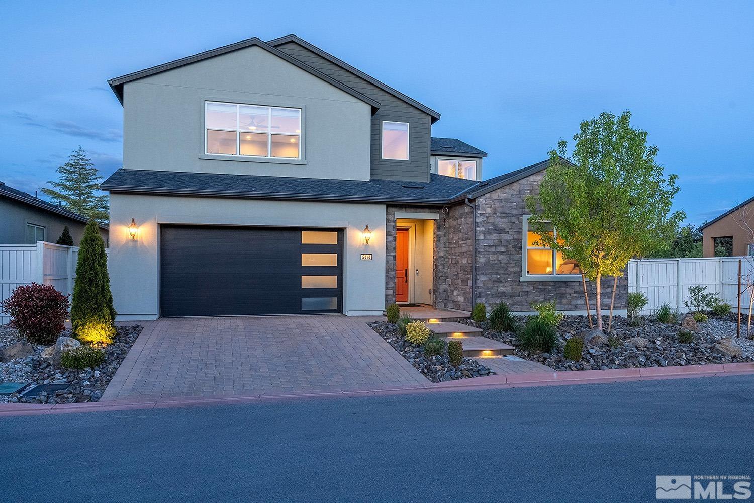 5414 Cremello Way Reno, NV 89511 - Photo 1 of 40 a front view of a house with trees and plants
