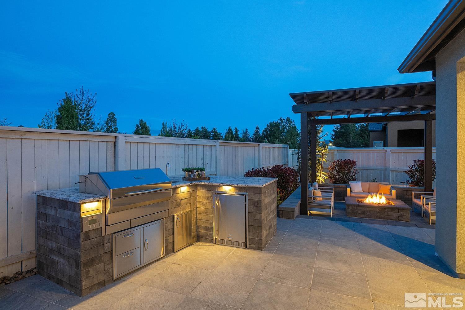 5414 Cremello Way Reno, NV 89511 - Photo 17 of 40 a view of a backyard with a tub and fire pit