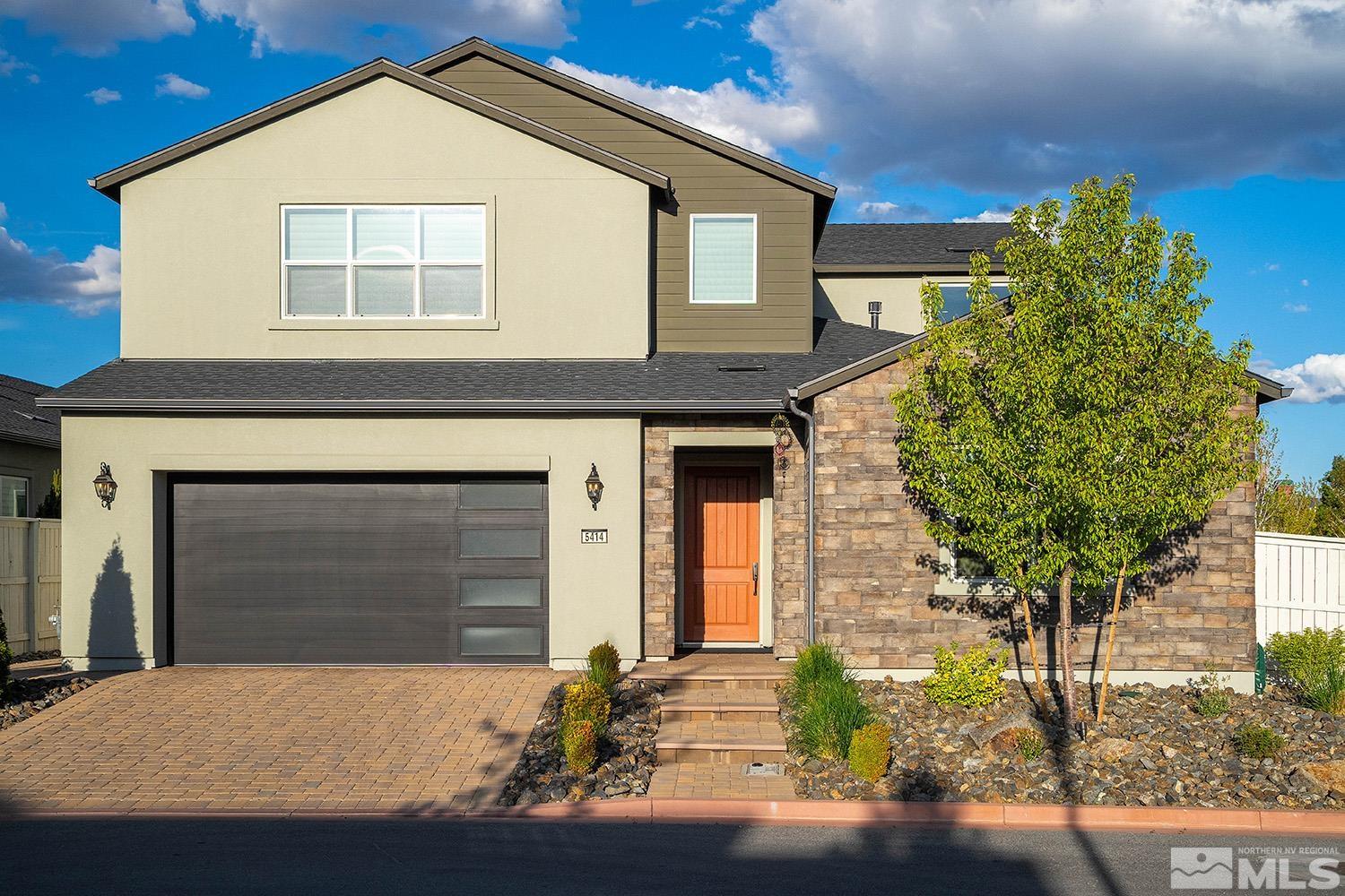 5414 Cremello Way Reno, NV 89511 - Photo 2 of 40 a front view of a house with a yard and garage