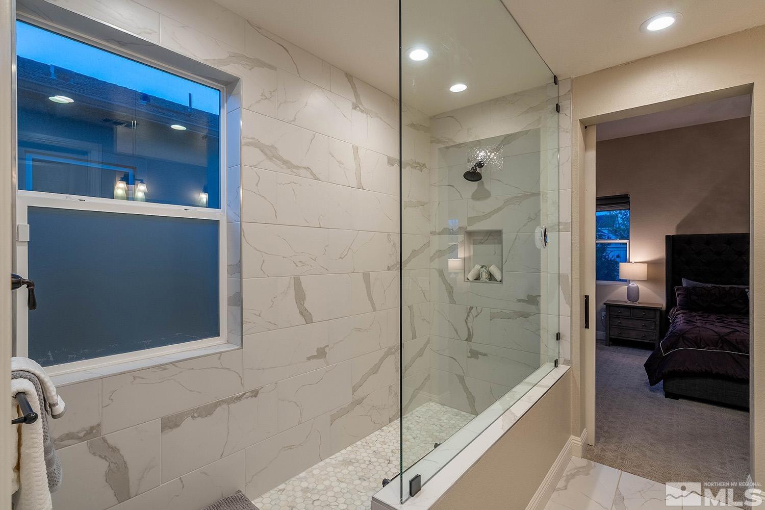 5414 Cremello Way Reno, NV 89511 - Photo 23 of 40 a bathroom with a bathtub and a shower