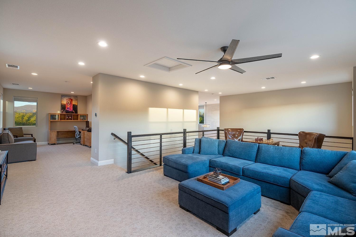 5414 Cremello Way Reno, NV 89511 - Photo 30 of 40 a living room with furniture a ceiling fan and a rug