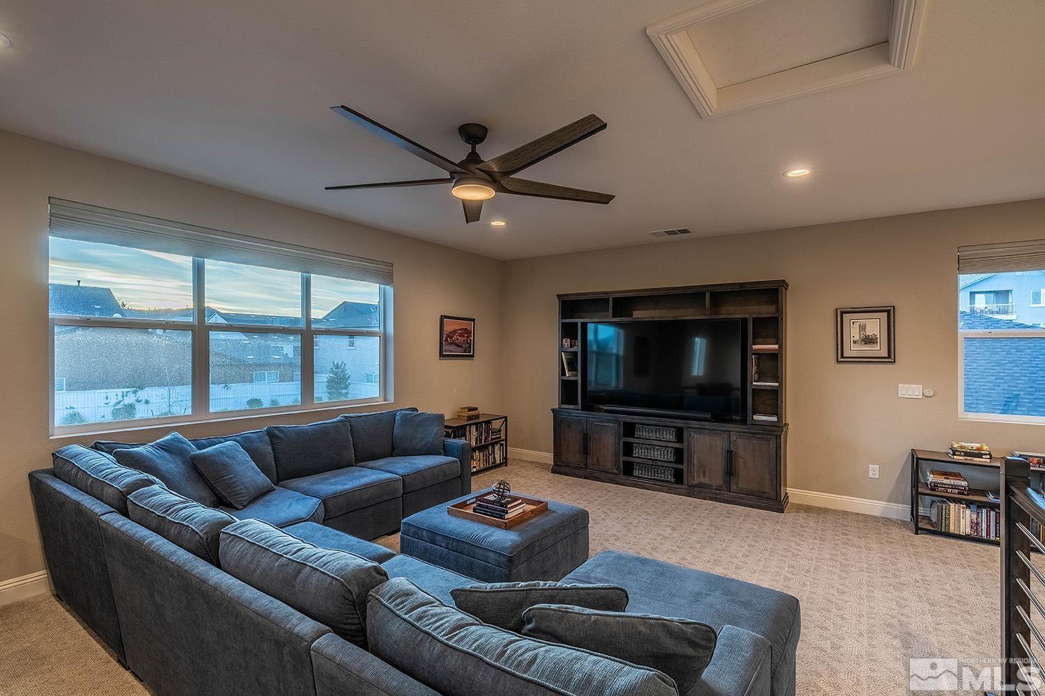 5414 Cremello Way Reno, NV 89511 - Photo 31 of 40 a living room with furniture and a flat screen tv
