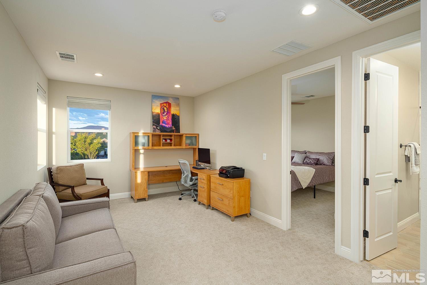 5414 Cremello Way Reno, NV 89511 - Photo 33 of 40 a living room with furniture and a walk in closet