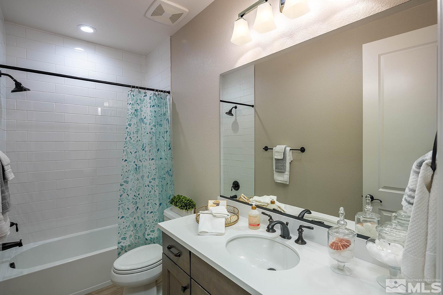 5414 Cremello Way Reno, NV 89511 - Photo 35 of 40 a bathroom with a sink toilet tub and shower
