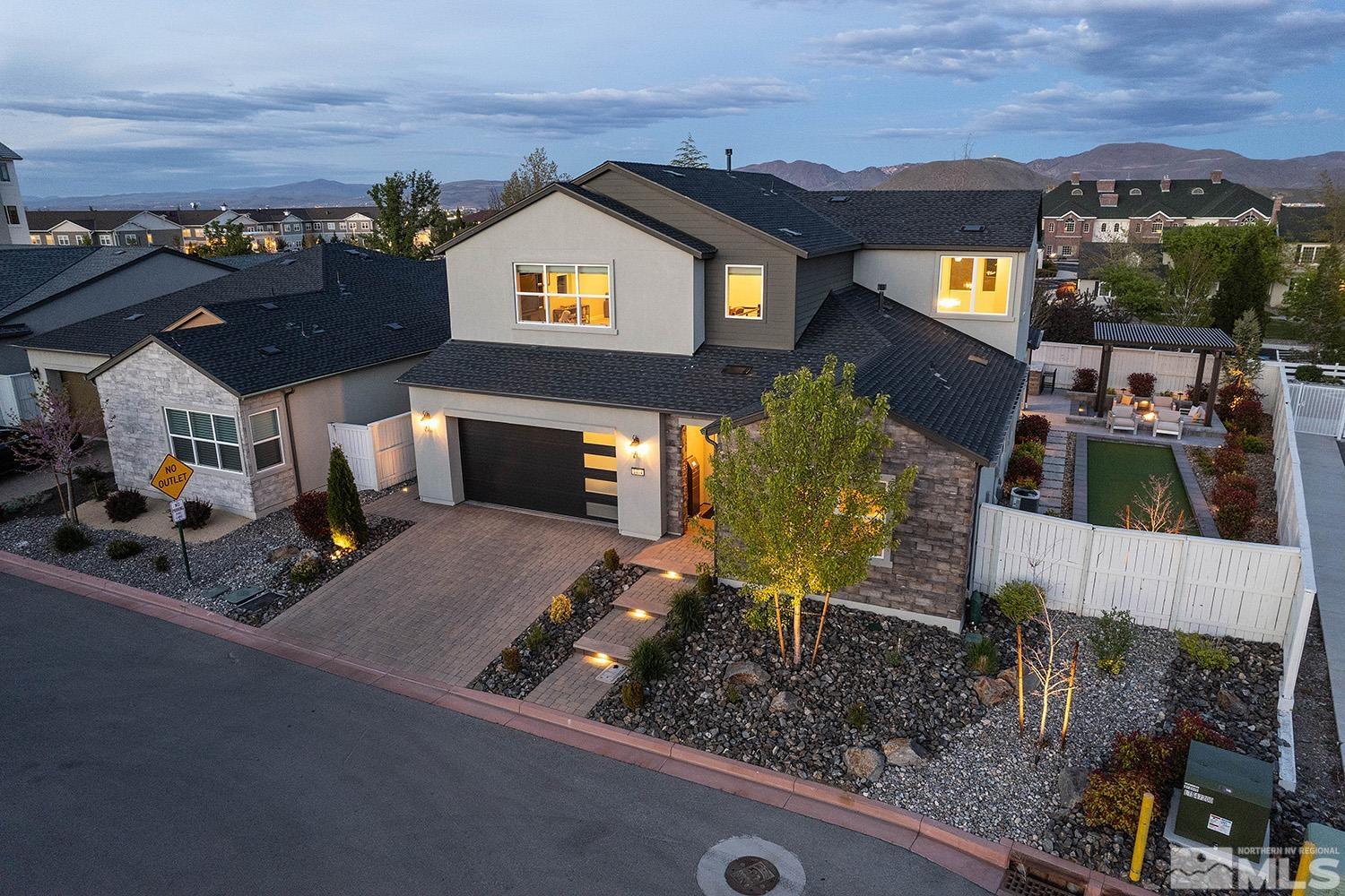 5414 Cremello Way Reno, NV 89511 - Photo 4 of 40 a front view of a house with a yard