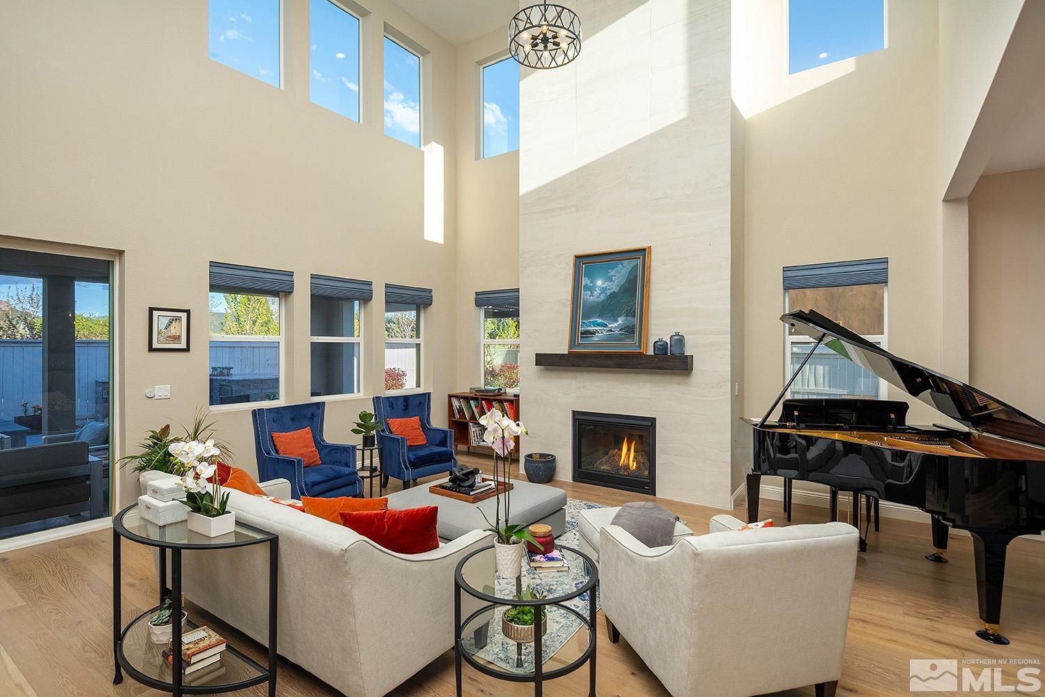 5414 Cremello Way Reno, NV 89511 - Photo 6 of 40 a living room with furniture and a fireplace