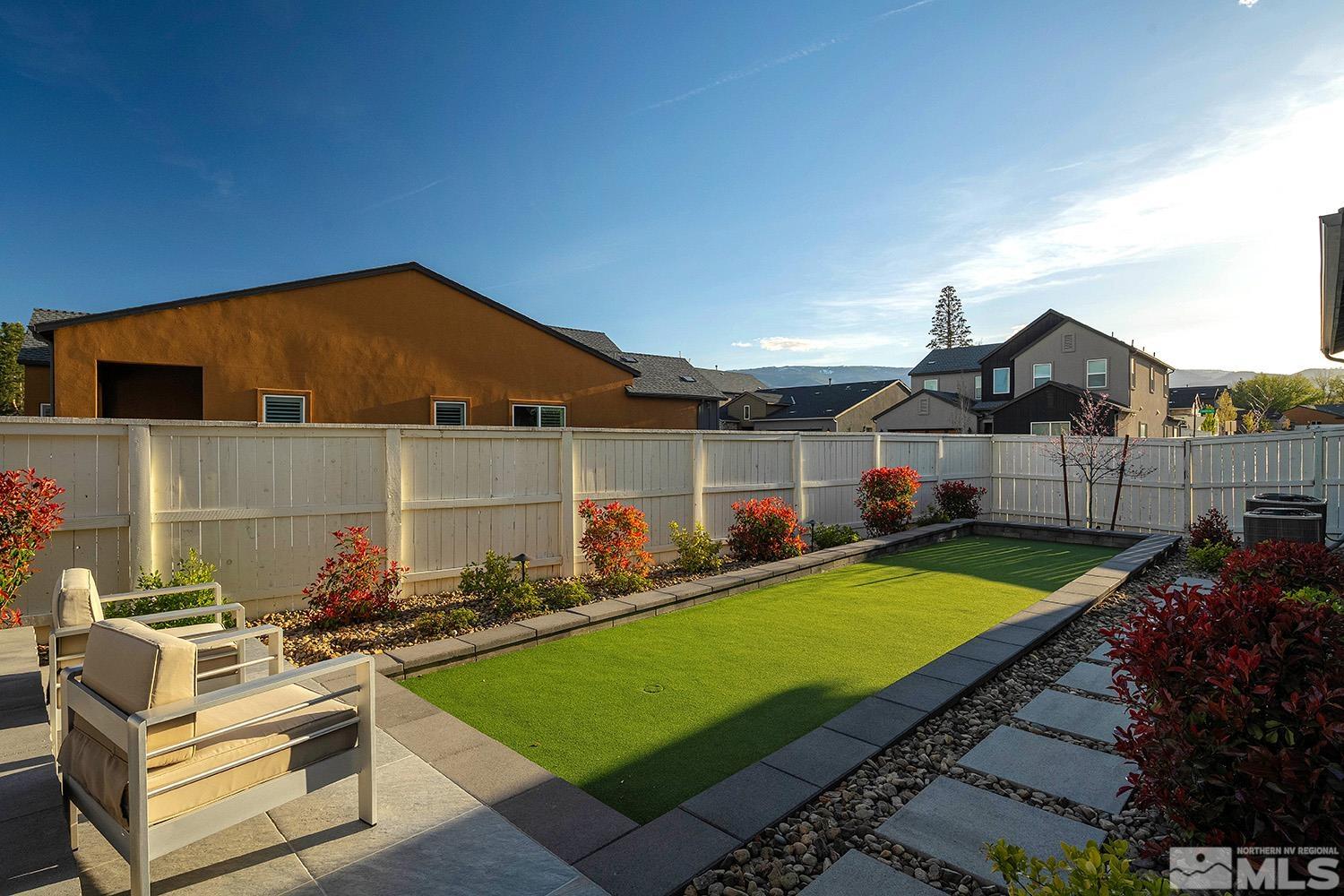 5414 Cremello Way Reno, NV 89511 - Photo 9 of 40 a view of an chairs and table in the backyard