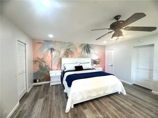 a bedroom with a bed and a mirror