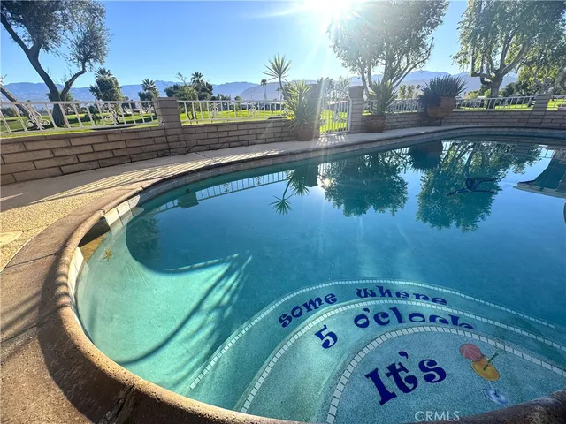 a view of swimming pool from a balcony