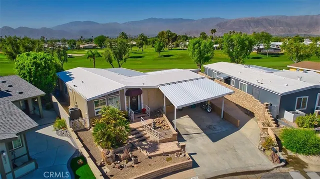 an aerial view of a house with a garden