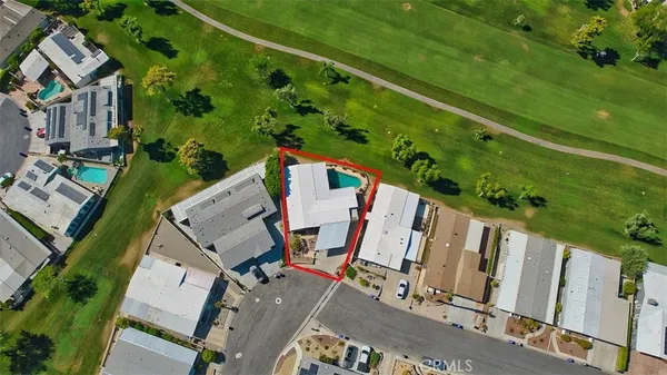 an aerial view of a house with a garden