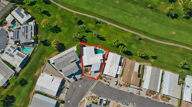 an aerial view of a house with a garden